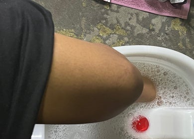 Foot soaking in a spa basin at Nails_bymomo6, Cape Town, Western Cape, ZA, offering a relaxing pedicure.