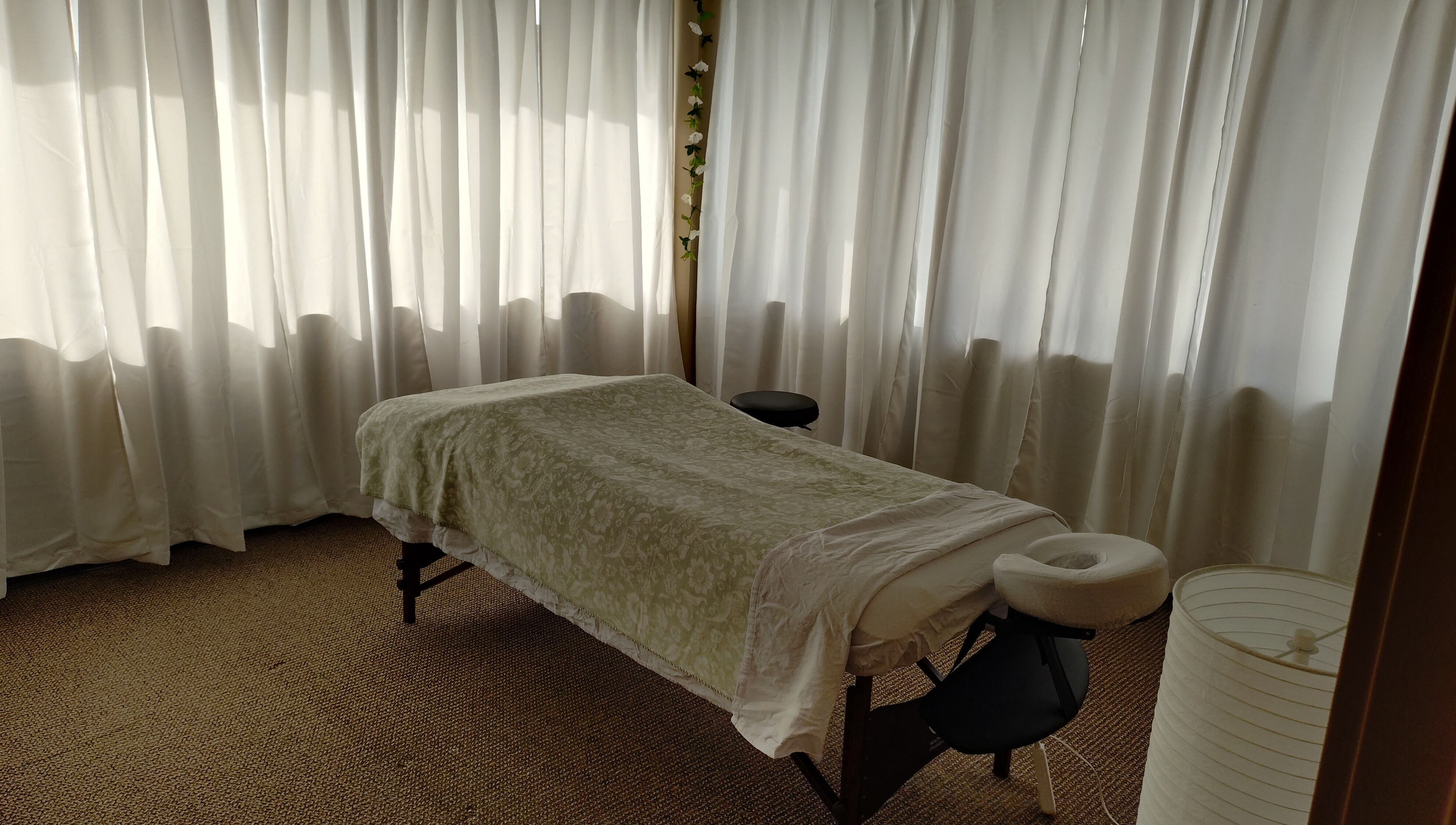 Relaxing massage room at A&I Massage Solution, Spruce Grove, Alberta, CA, with a cozy massage table.