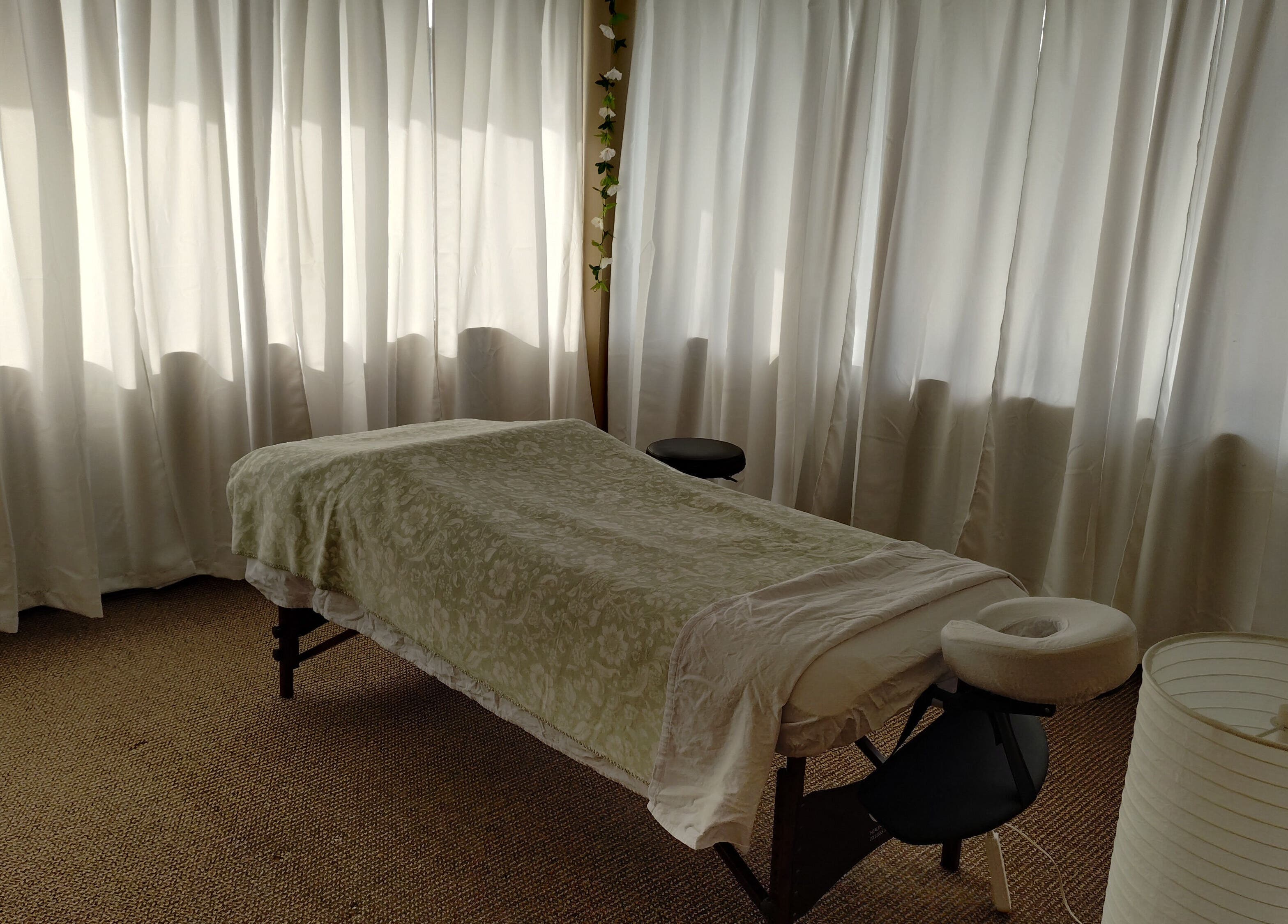 Relaxing massage room at A&I Massage Solution, Spruce Grove, Alberta, CA, with a cozy massage table.