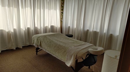 Relaxing massage room at A&I Massage Solution, Spruce Grove, Alberta, CA, with a cozy massage table.