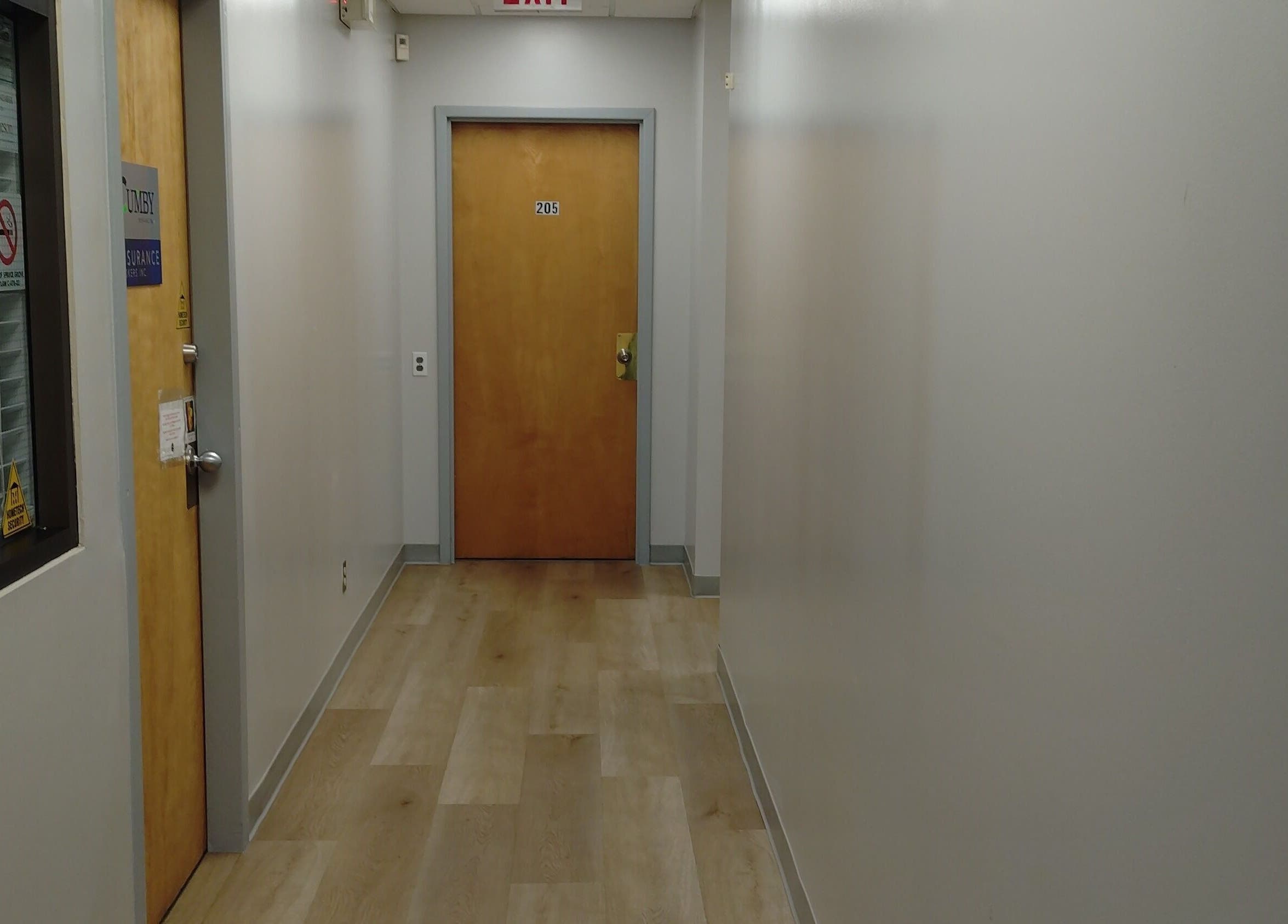 Calm corridor at A&I Massage Solution in Spruce Grove, Alberta, CA leading to wellness rooms.