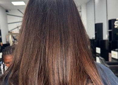 Smooth brown hair in stylish salon setting at ELEVATION HAIR 93 BY JULZ, Midrand, Gauteng, ZA.