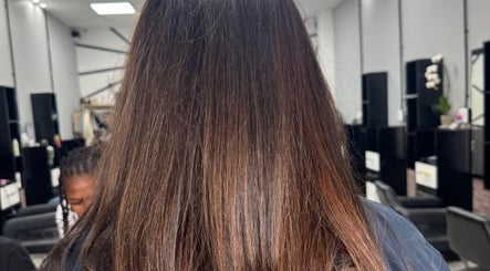 Smooth brown hair in stylish salon setting at ELEVATION HAIR 93 BY JULZ, Midrand, Gauteng, ZA.