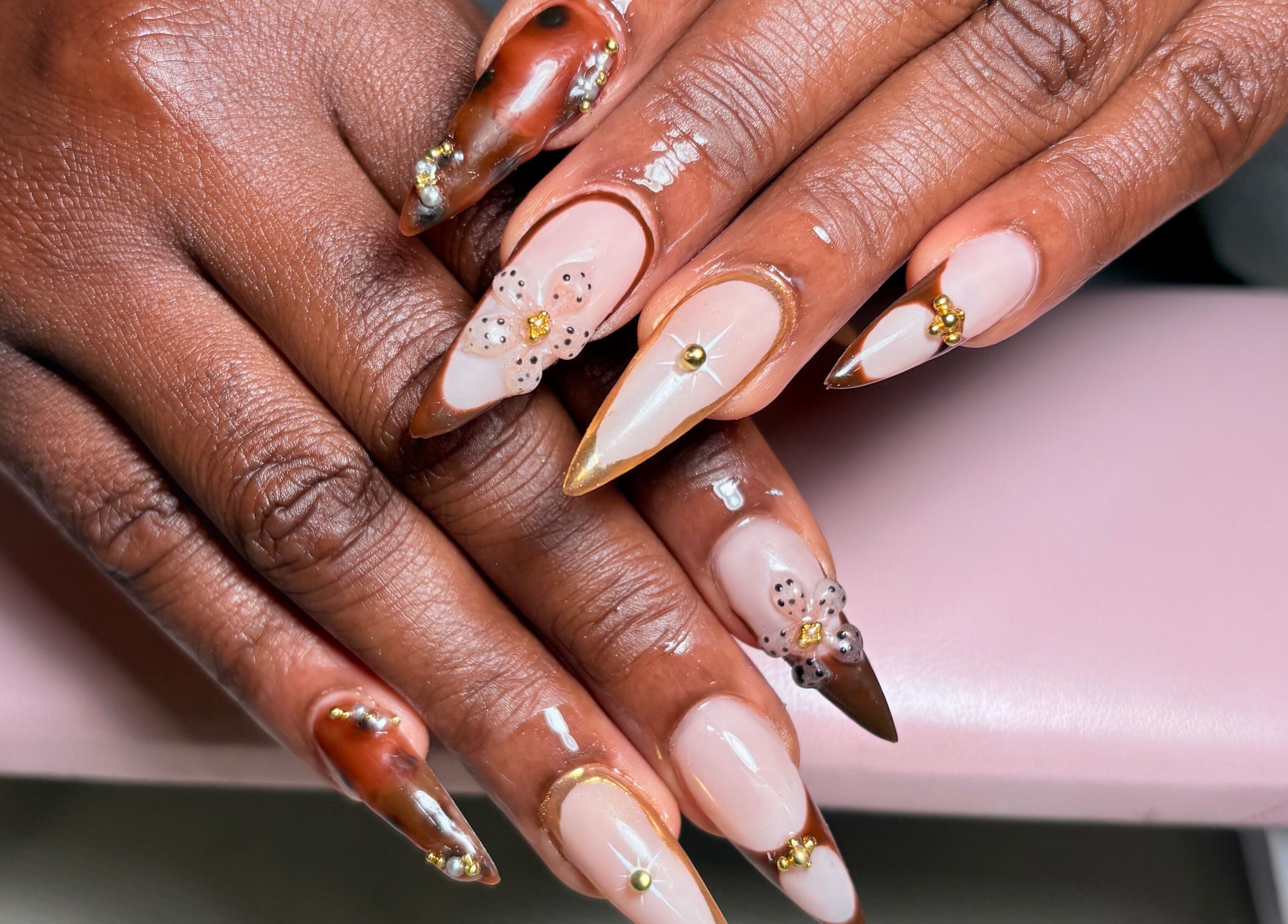 Stylish floral nail art at KuredKlaws, Ottawa, Ontario, CA, showcasing intricate designs and detailing.