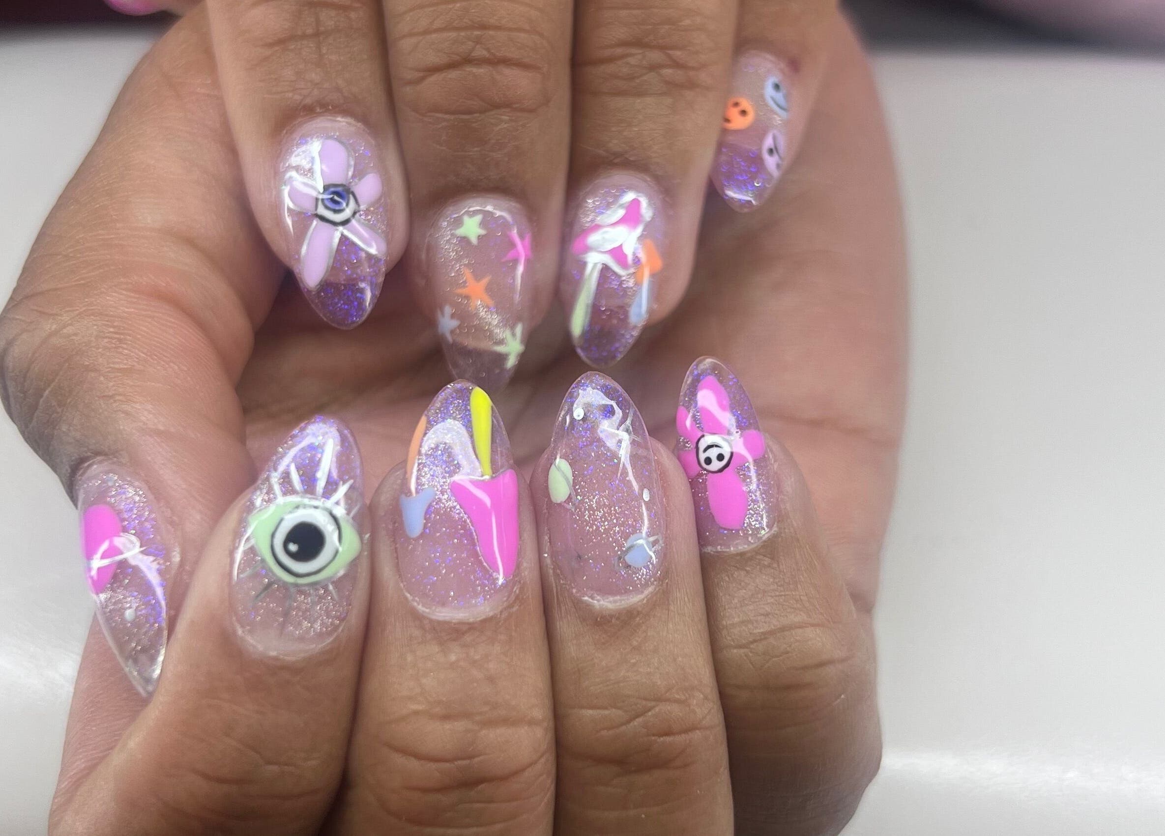 Colorful nail art design at Puff Polish, Ottawa, Ontario, CA showcasing vibrant patterns.