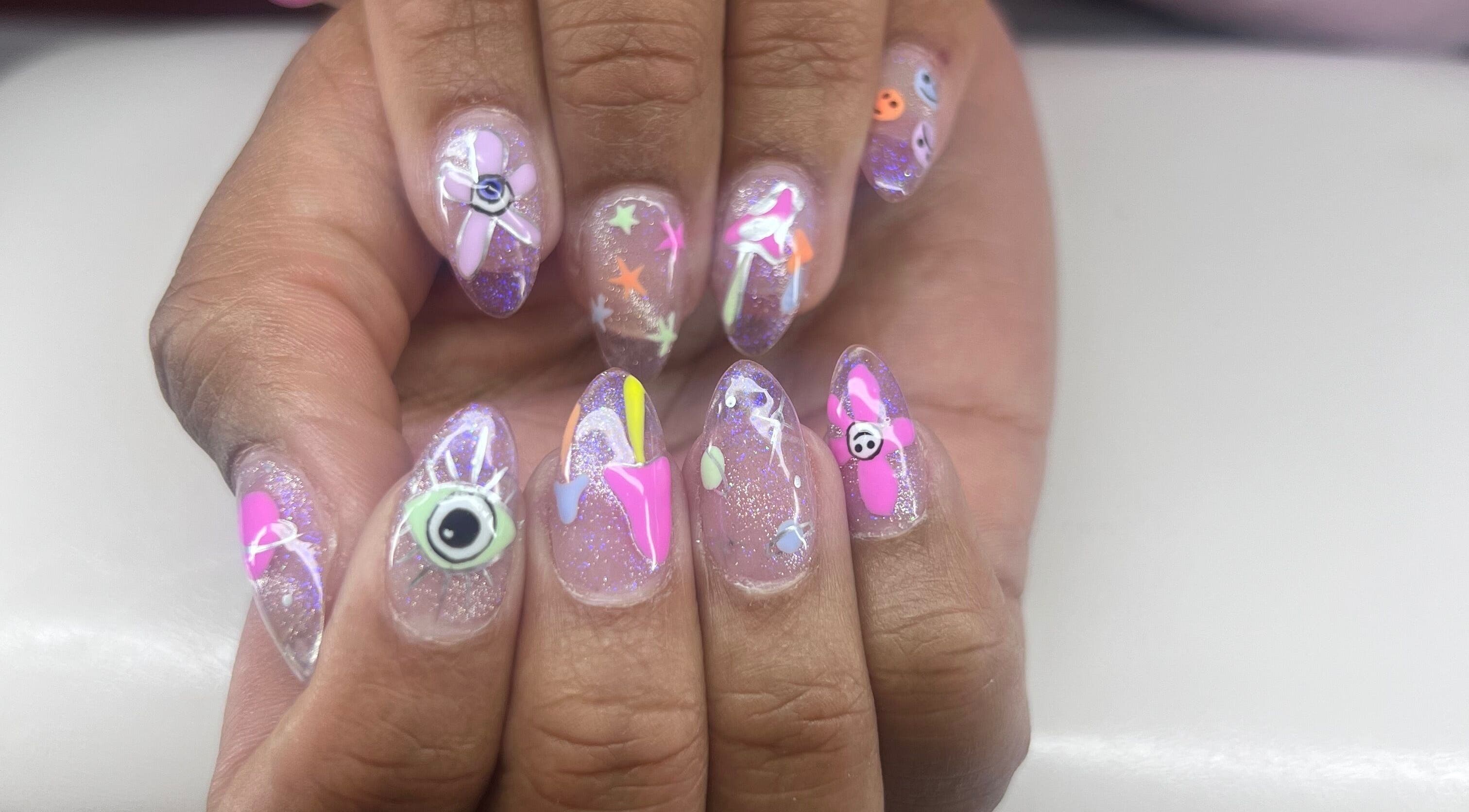 Colorful nail art design at Puff Polish, Ottawa, Ontario, CA showcasing vibrant patterns.