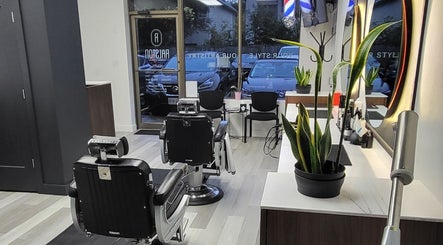 Cozy interior of Ralston Barber Studio in Mississauga, Ontario, CA with modern barber chairs and decor.