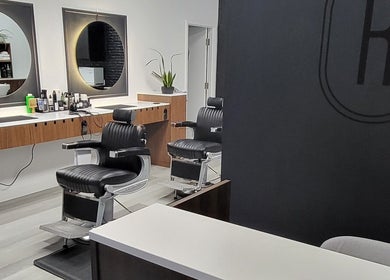 Ralston Barber Studio in Mississauga, Ontario, CA, features modern barber chairs and stylish mirrors.