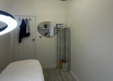 Relaxing spa room at Sildasbeauty, London, England, GB with a massage table and ambient lighting.