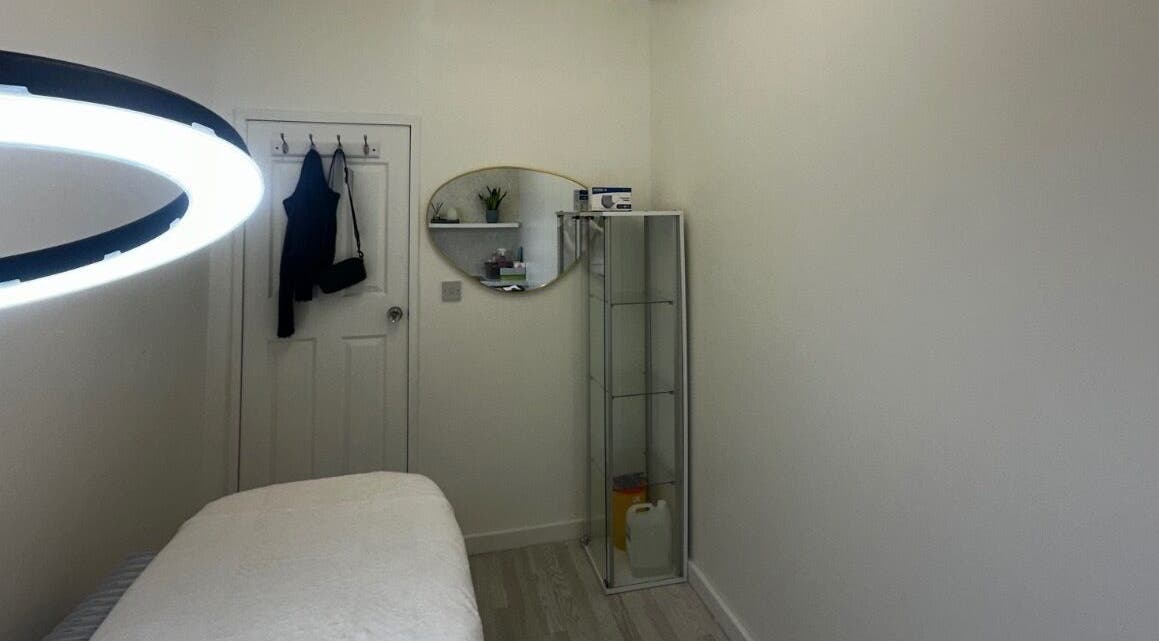 Relaxing spa room at Sildasbeauty, London, England, GB with a massage table and ambient lighting.