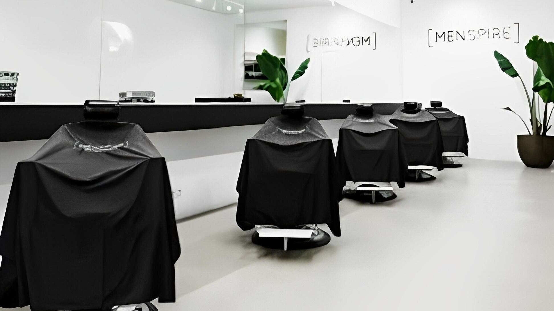 Modern barber chairs at MENSPIRE De Pijp, Amsterdam, Noord-Holland, NL offering stylish grooming services.
