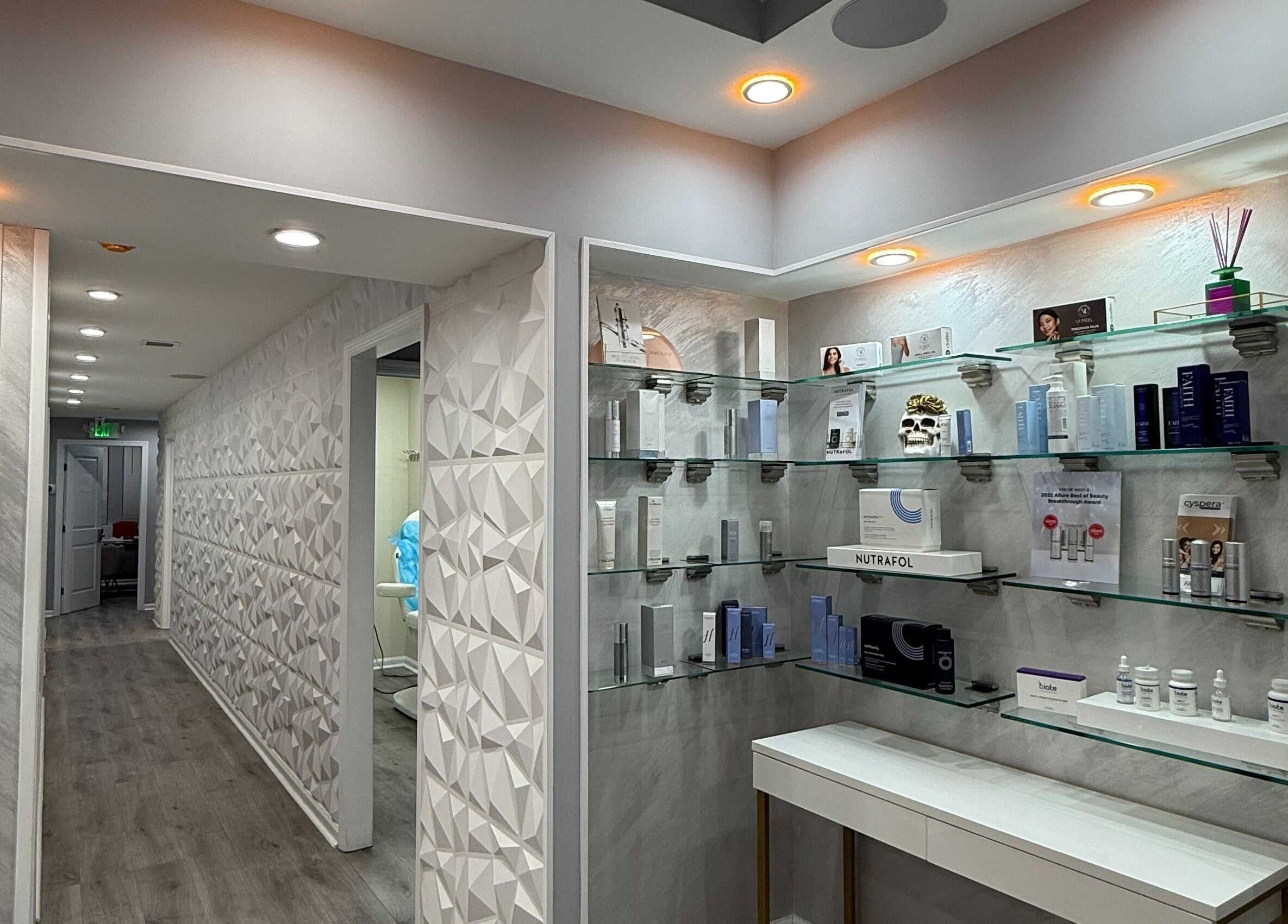 Modern interior of Injectables NYC in New York, New York, US, showcasing sleek product display shelves.