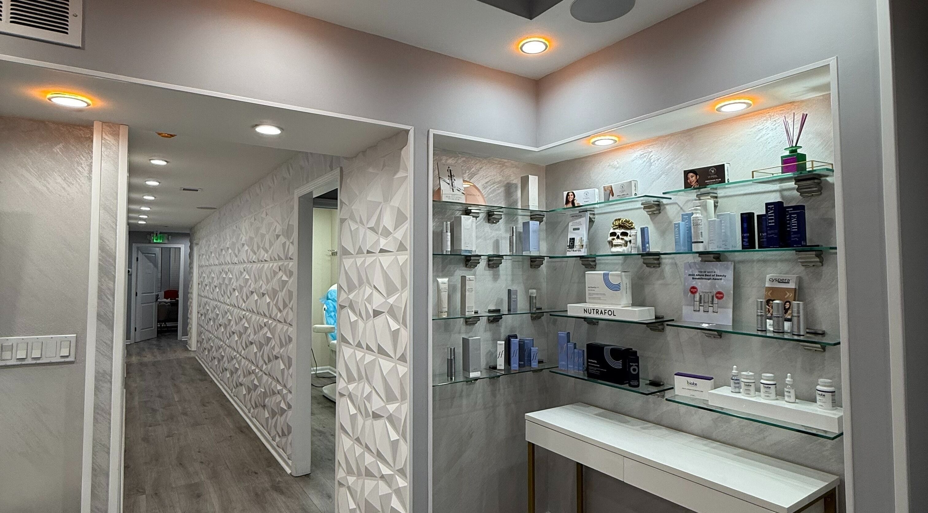 Modern interior of Injectables NYC in New York, New York, US, showcasing sleek product display shelves.