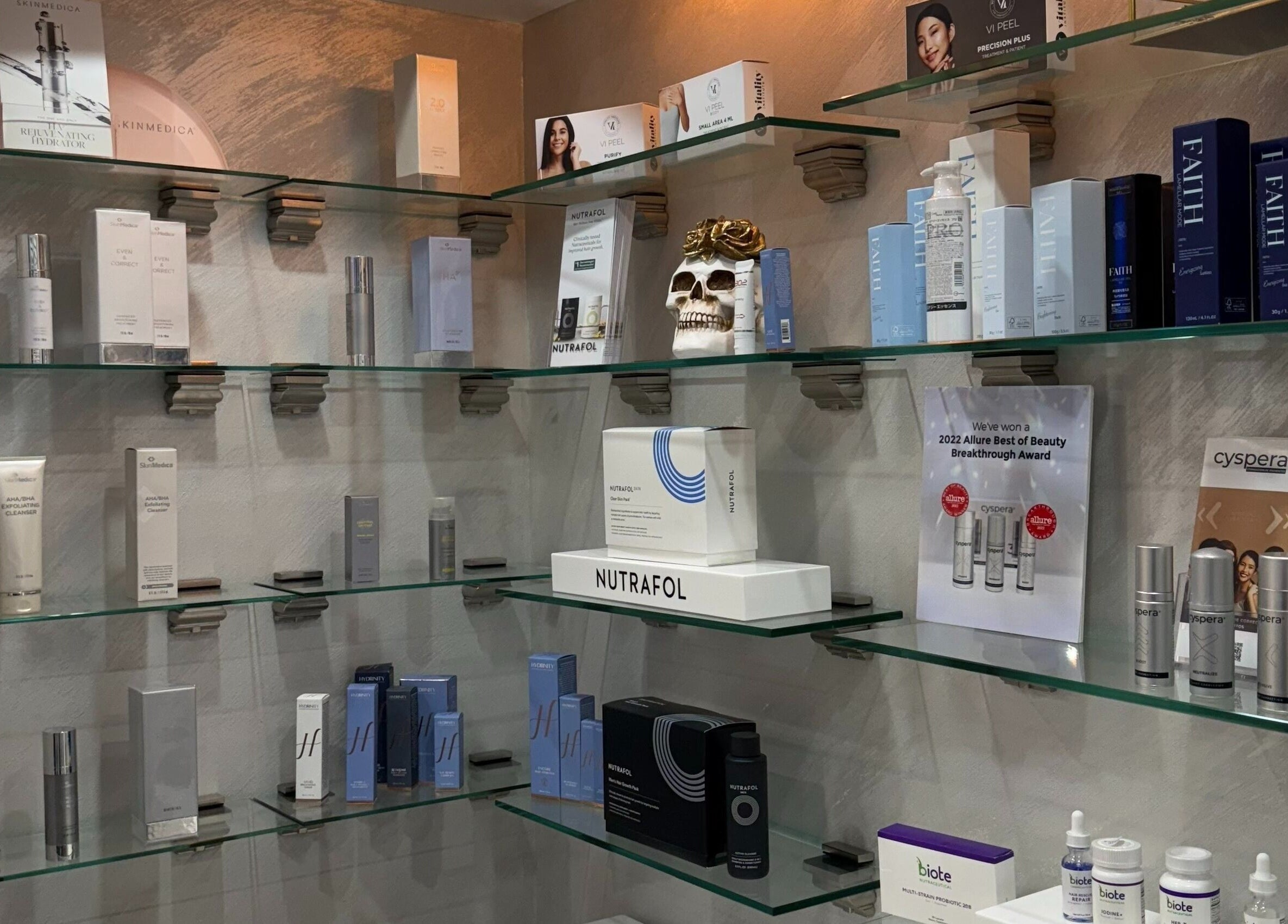 Shelves of premium skincare products at Injectables NYC, New York, New York, US, showcasing brand variety.