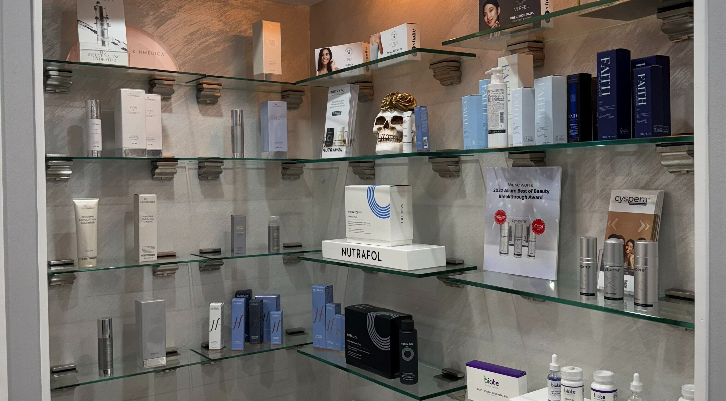 Shelves of premium skincare products at Injectables NYC, New York, New York, US, showcasing brand variety.