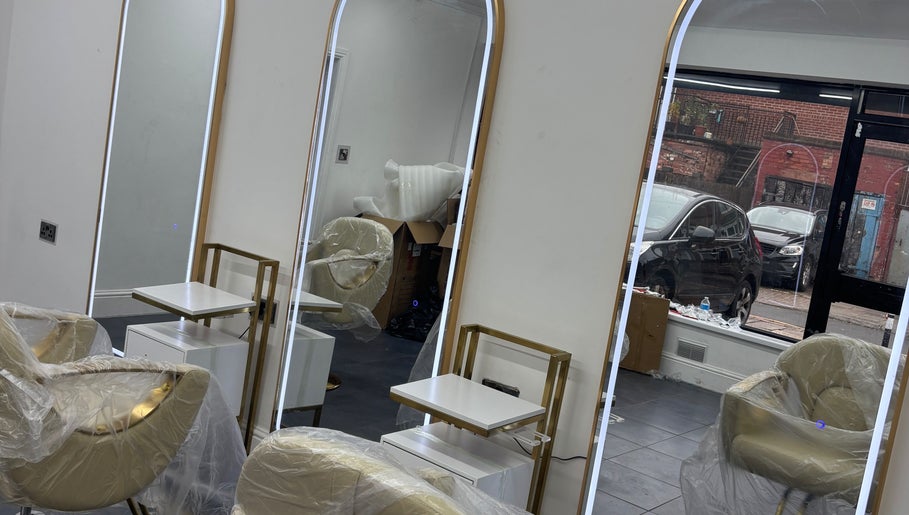 Modern salon mirrors and chairs at Maison La Tresse, Birmingham, England, GB.