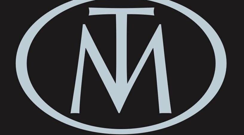 Logo of Total Makeover, a beauty venue in Crewe, England, GB, featuring a stylish monogram.