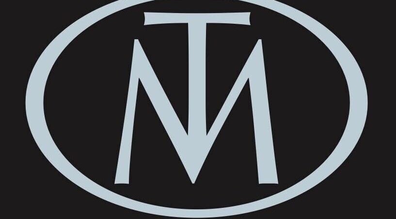 Logo of Total Makeover, a beauty venue in Crewe, England, GB, featuring a stylish monogram.