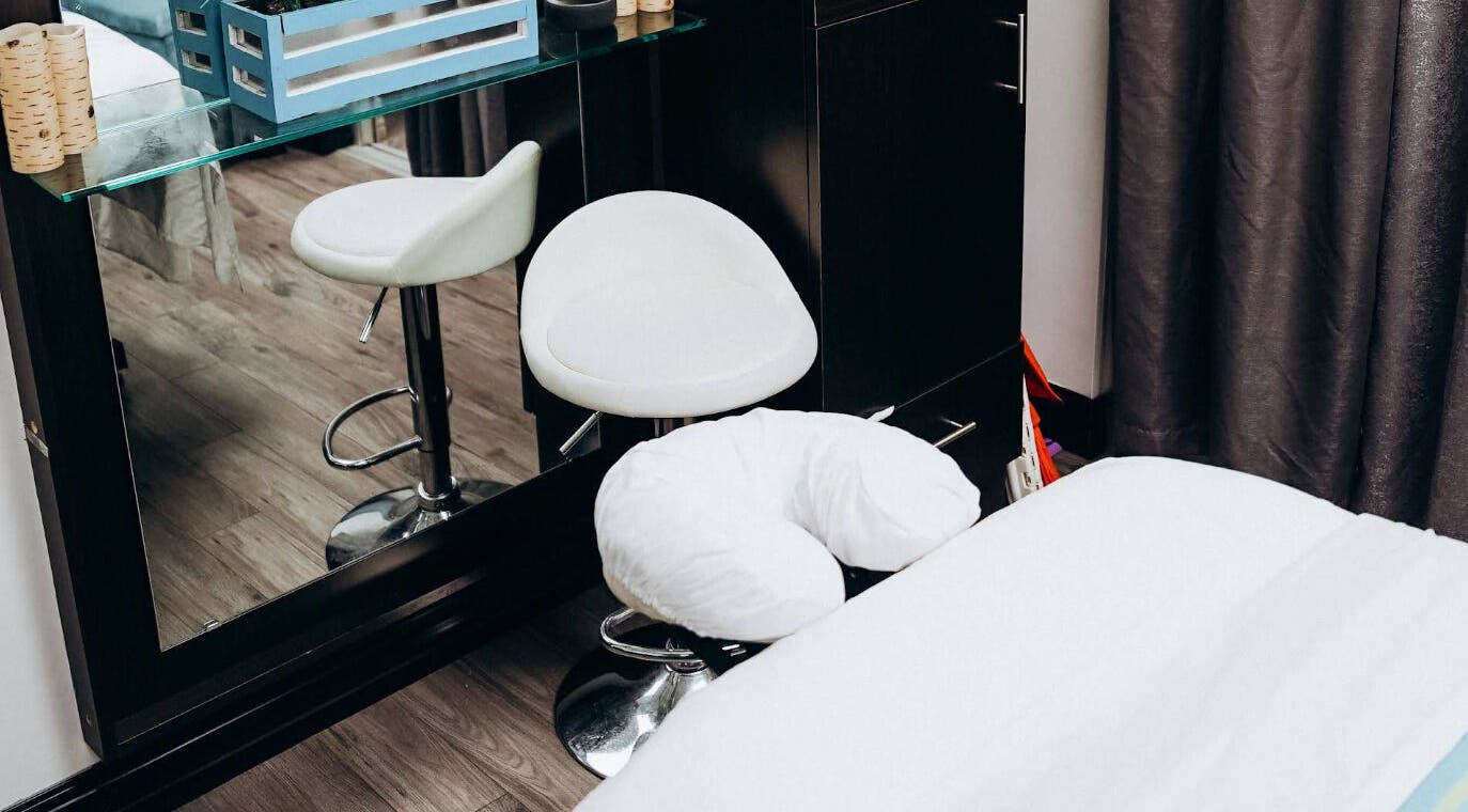 Modern massage room at Natasha & Co Massage in Newton, Massachusetts, US with chic decor and a relaxing ambiance.