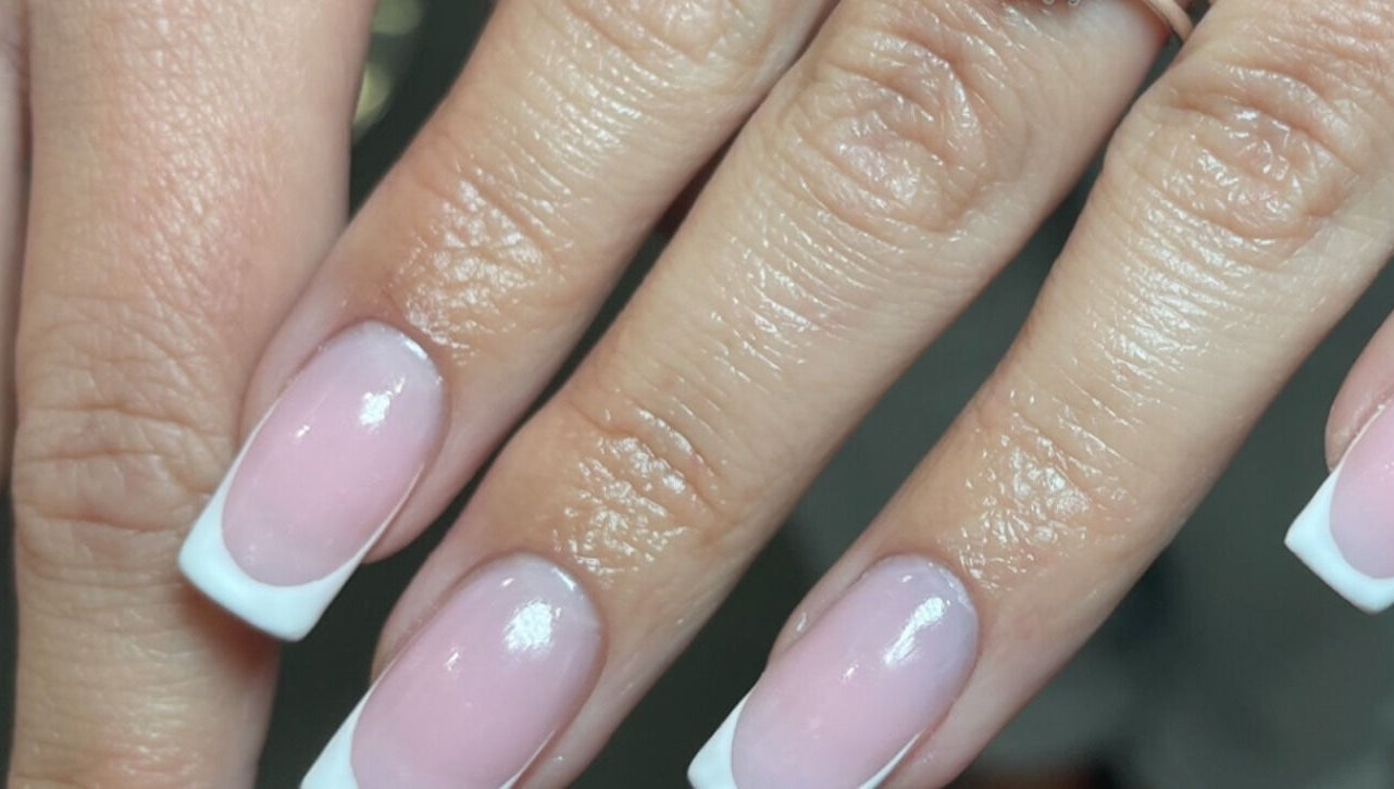 Elegant French manicure at Aura Nail Studio, Fairy Meadow, New South Wales, AU.