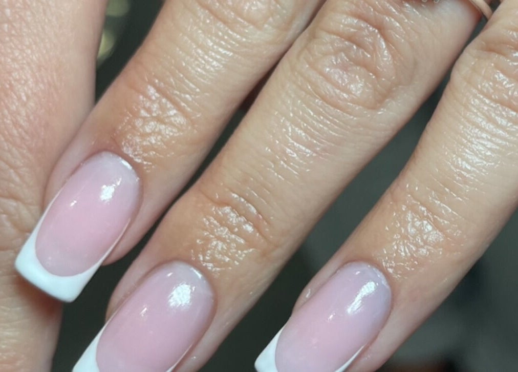 Elegant French manicure at Aura Nail Studio, Fairy Meadow, New South Wales, AU.