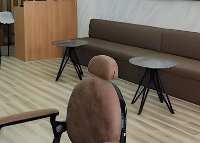 Cozy seating area in Barbers Vision, Melbourne, Victoria, AU with modern chairs and tables.