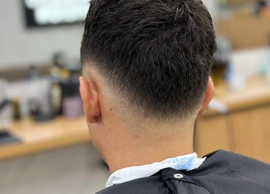 Fresh fade haircut at Barbers Vision in Melbourne, Victoria, AU showcasing expert styling.