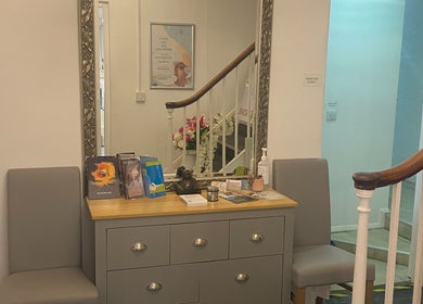 Entrance of Hude in Royal Tunbridge Wells, England, GB featuring a stylish dresser and decorative items.
