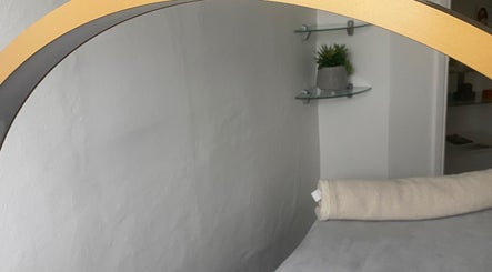 Relaxing spa room at Hude, Royal Tunbridge Wells, England, GB with plush towel and elegant decor.