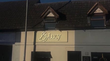 The Skin Theory in Lichfield, England, GB features elegant signage on a classic building.