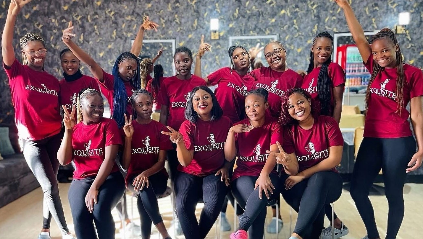 Smiling team at Exquisite Pulchritude salon, Lusaka, Lusaka Province, ZM in matching attire.