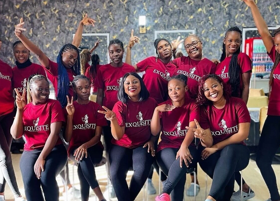 Smiling team at Exquisite Pulchritude salon, Lusaka, Lusaka Province, ZM in matching attire.