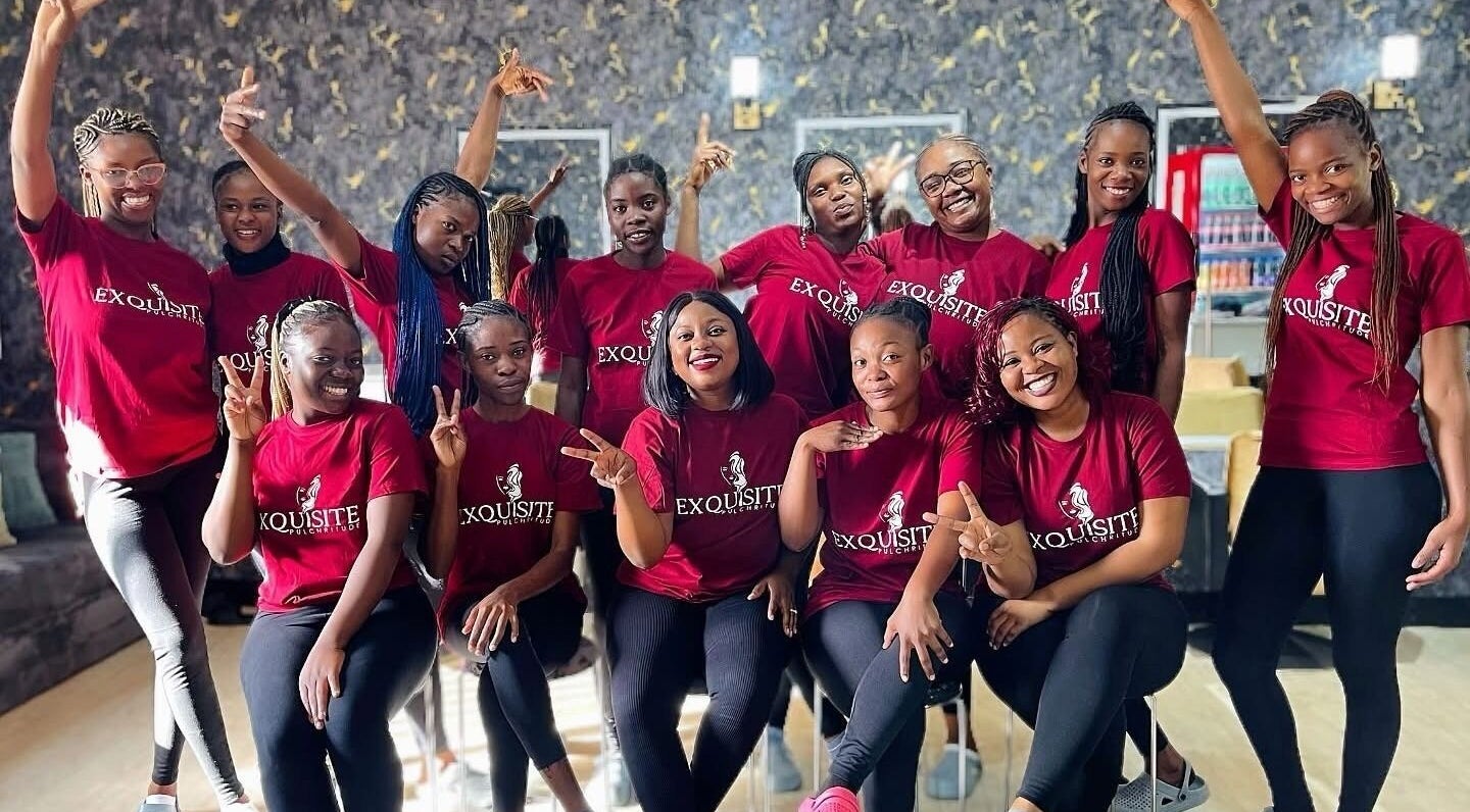 Smiling team at Exquisite Pulchritude salon, Lusaka, Lusaka Province, ZM in matching attire.