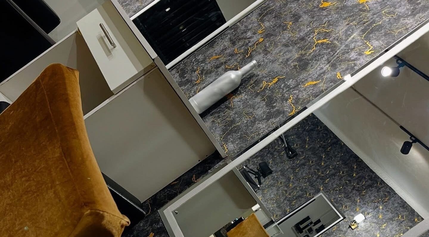 Modern salon interior at Exquisite Pulchritude in Lusaka, Lusaka Province, ZM, featuring elegant design elements.