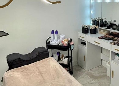 Evelina's Lashes salon room in London, England, GB, featuring a makeup vanity and lash extension tools.