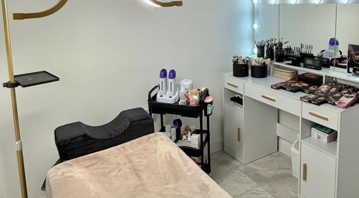 Evelina's Lashes salon room in London, England, GB, featuring a makeup vanity and lash extension tools.