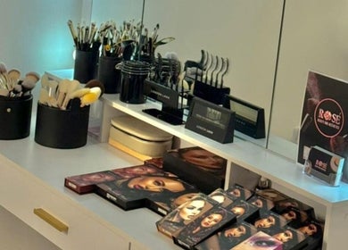 Makeup station with brushes and palettes at Evelina's Lashes in London, England, GB.