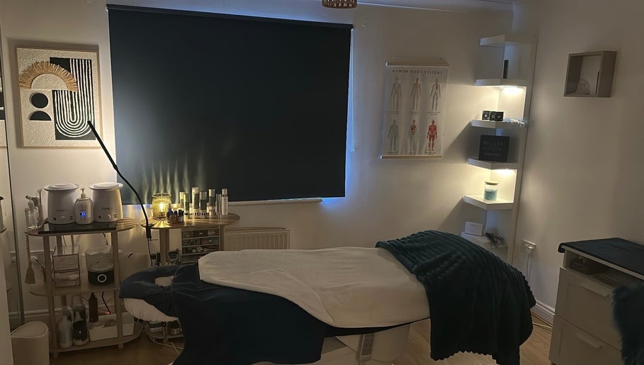 Relaxing treatment room at Lilybella Beauty, Chudleigh, England, GB, featuring cozy lighting and modern decor.