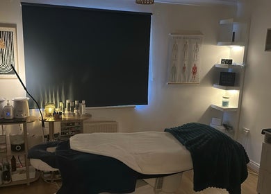 Relaxing treatment room at Lilybella Beauty, Chudleigh, England, GB, featuring cozy lighting and modern decor.