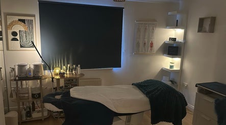 Relaxing treatment room at Lilybella Beauty, Chudleigh, England, GB, featuring cozy lighting and modern decor.