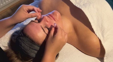 Facial massage at Lilybella Beauty in Chudleigh, England, GB, enhancing relaxation and skin rejuvenation.