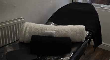 Luxurious treatment bed with plush towels at By Tuesday Skin Studio, Eccles, England, GB.