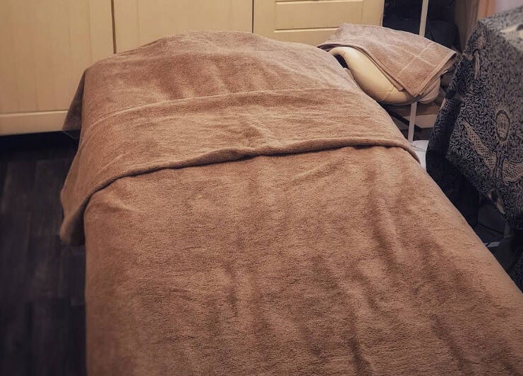 Relaxing treatment bed at The Blissful Element, Chandler's Ford, England, GB, inviting relaxation and comfort.