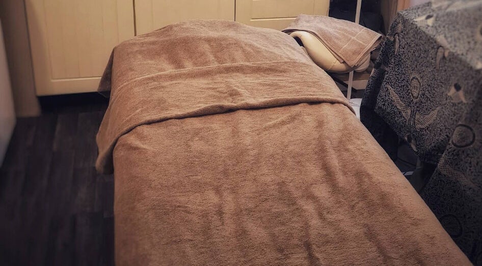 Relaxing treatment bed at The Blissful Element, Chandler's Ford, England, GB, inviting relaxation and comfort.