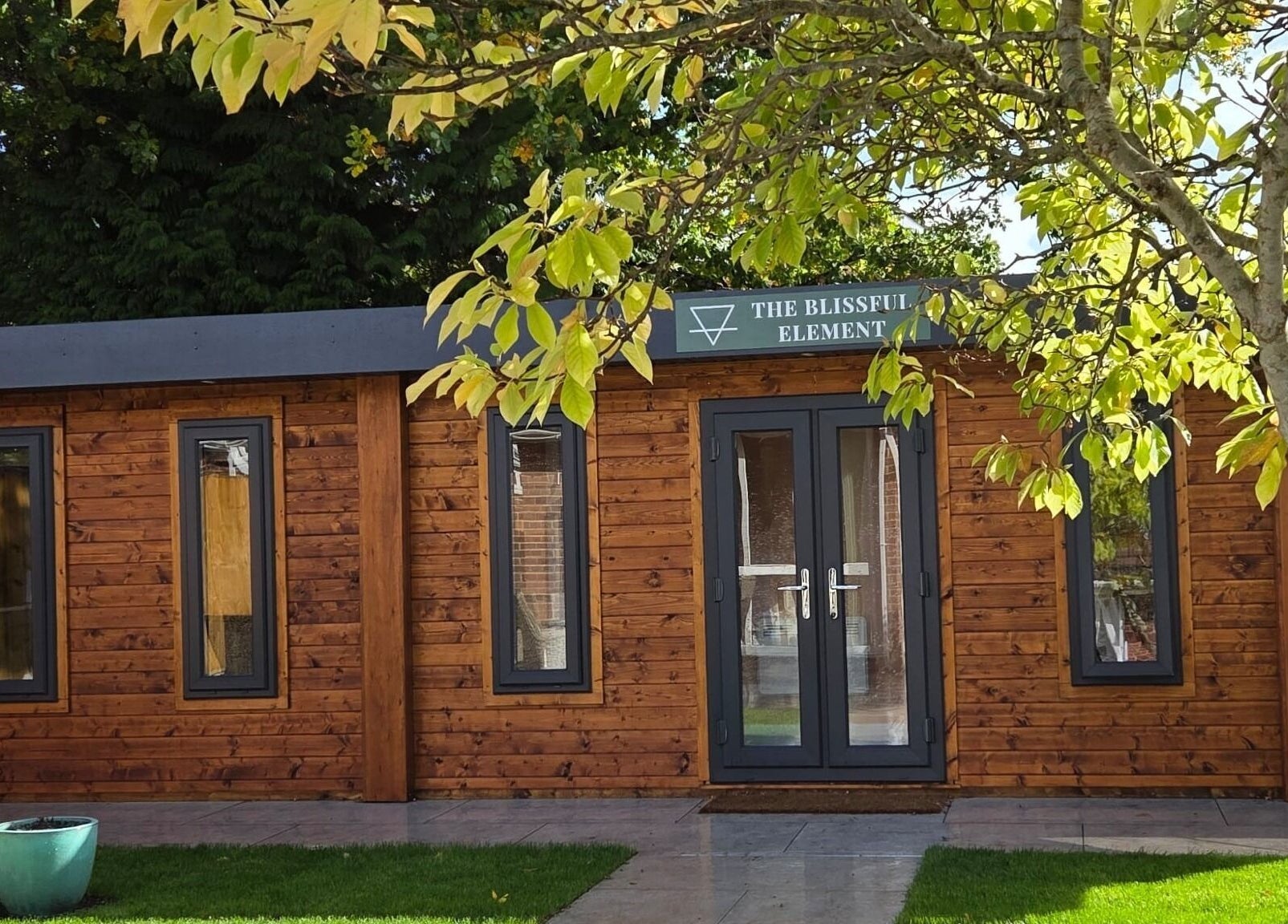 Wooden façade of The Blissful Element, a tranquil wellness venue in Chandler's Ford, England, GB.