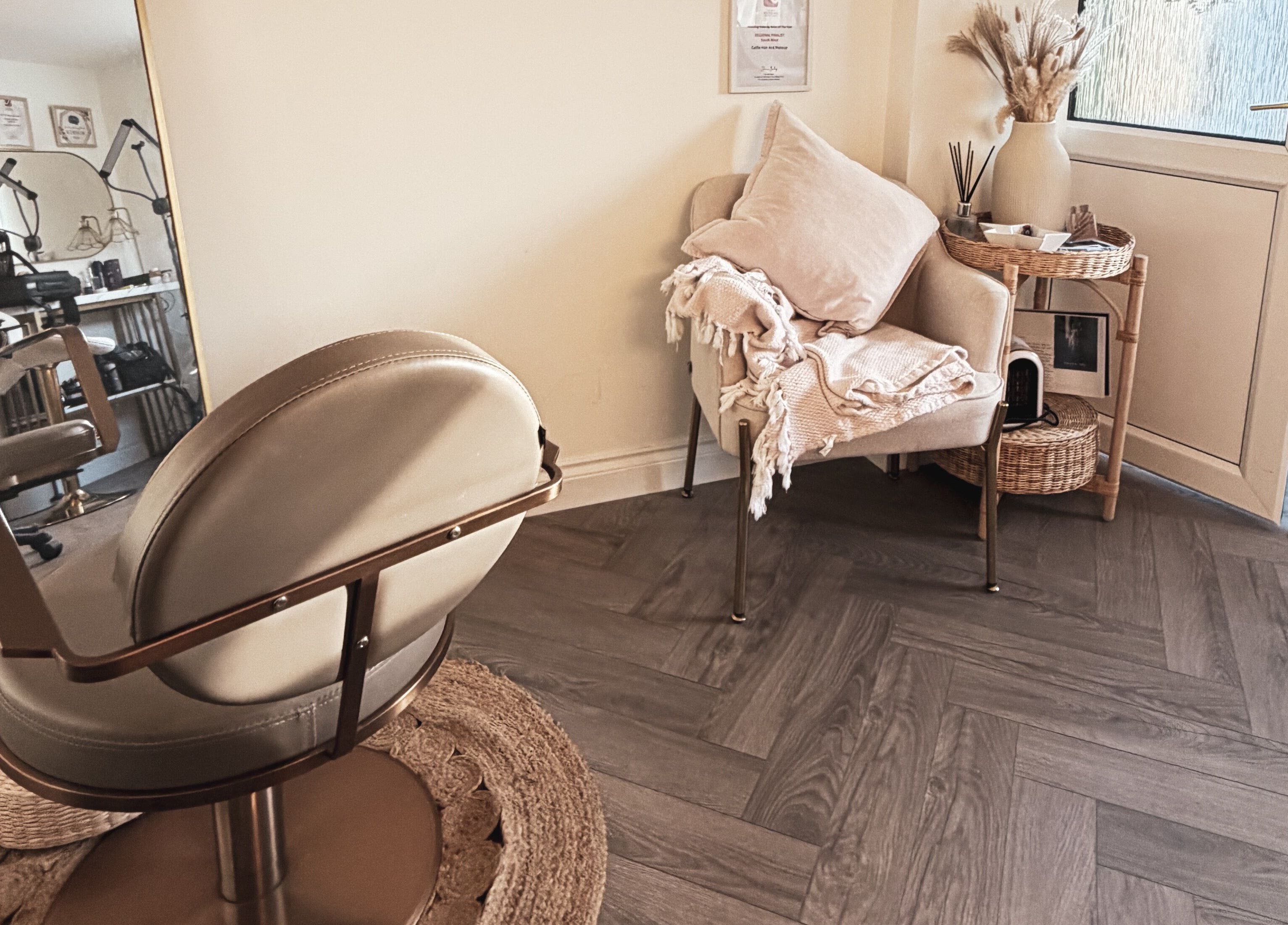 Elegant seating area with salon chair at Celfie Bridal Hair and Makeup, Midsomer Norton, England, GB.