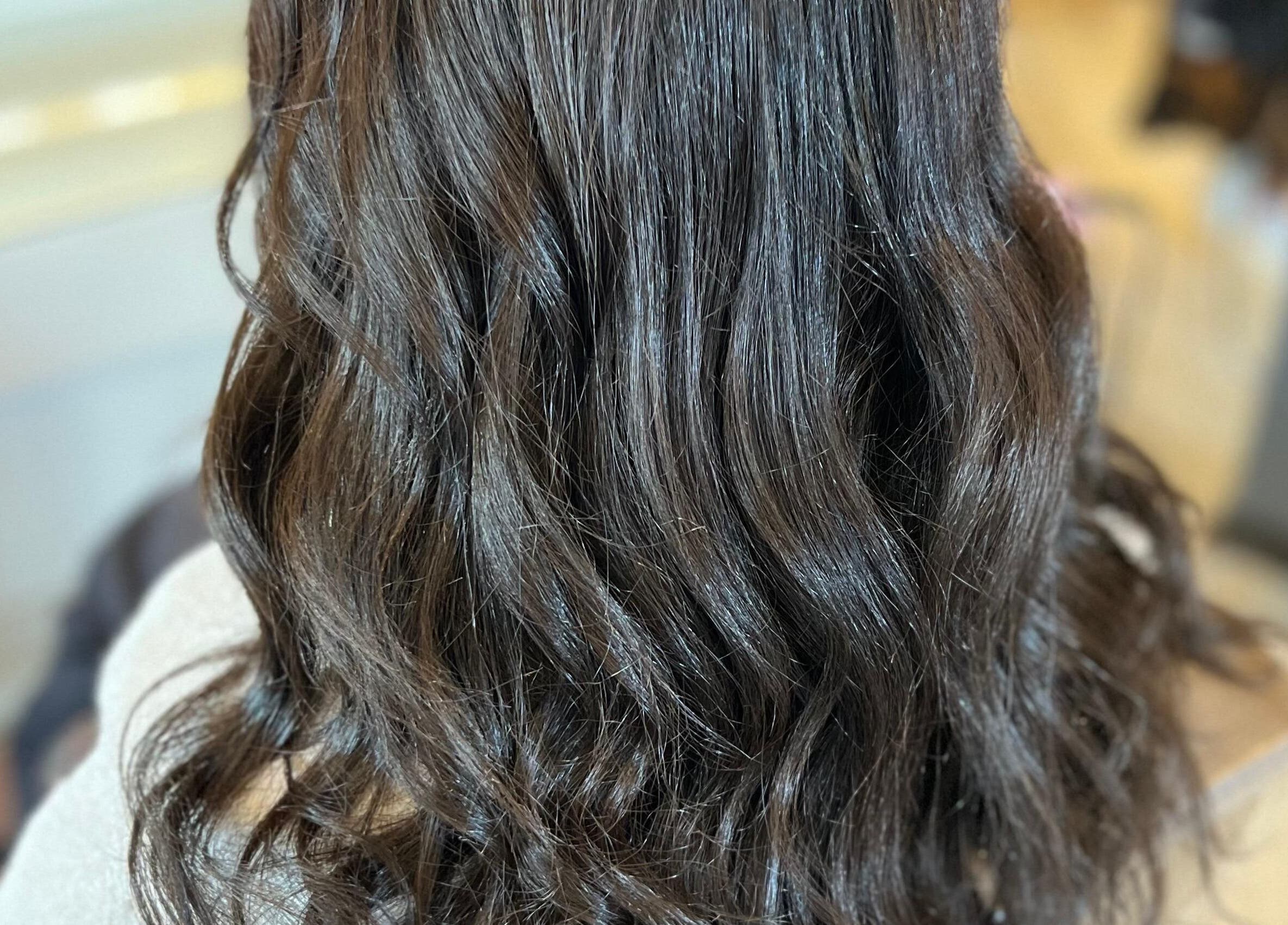 Elegant wavy brunette hairstyle at Hair by Abby, Worcester, Western Cape, ZA.