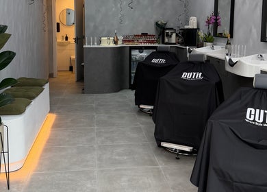 Modern interior of CUTit. salon in Beckenham, England, GB with sleek chairs and chic decor.