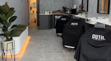 Modern interior of CUTit. salon in Beckenham, England, GB with sleek chairs and chic decor.