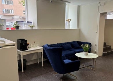 Inviting lounge area with blue seating at Best beauty ST, Stockholm, Stockholms Län, SE, perfect for relaxation.